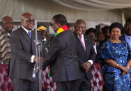 Zimbabwe's President Emmerson Mnangagwa greets other heads of states during his inauguration ceremony at the National Sports Stadium in the capital Harare, Monday, Sept. 4, 2023. Mnangagwa Monday hailed recent elections as a sign of the country’s “mature democracy” and a victory over Western adversaries, as he took an oath of office following polls whose credibility was questioned by multiple observer missions, including those from Africa. (AP Photo /Tsvangirayi Mukwazhi)