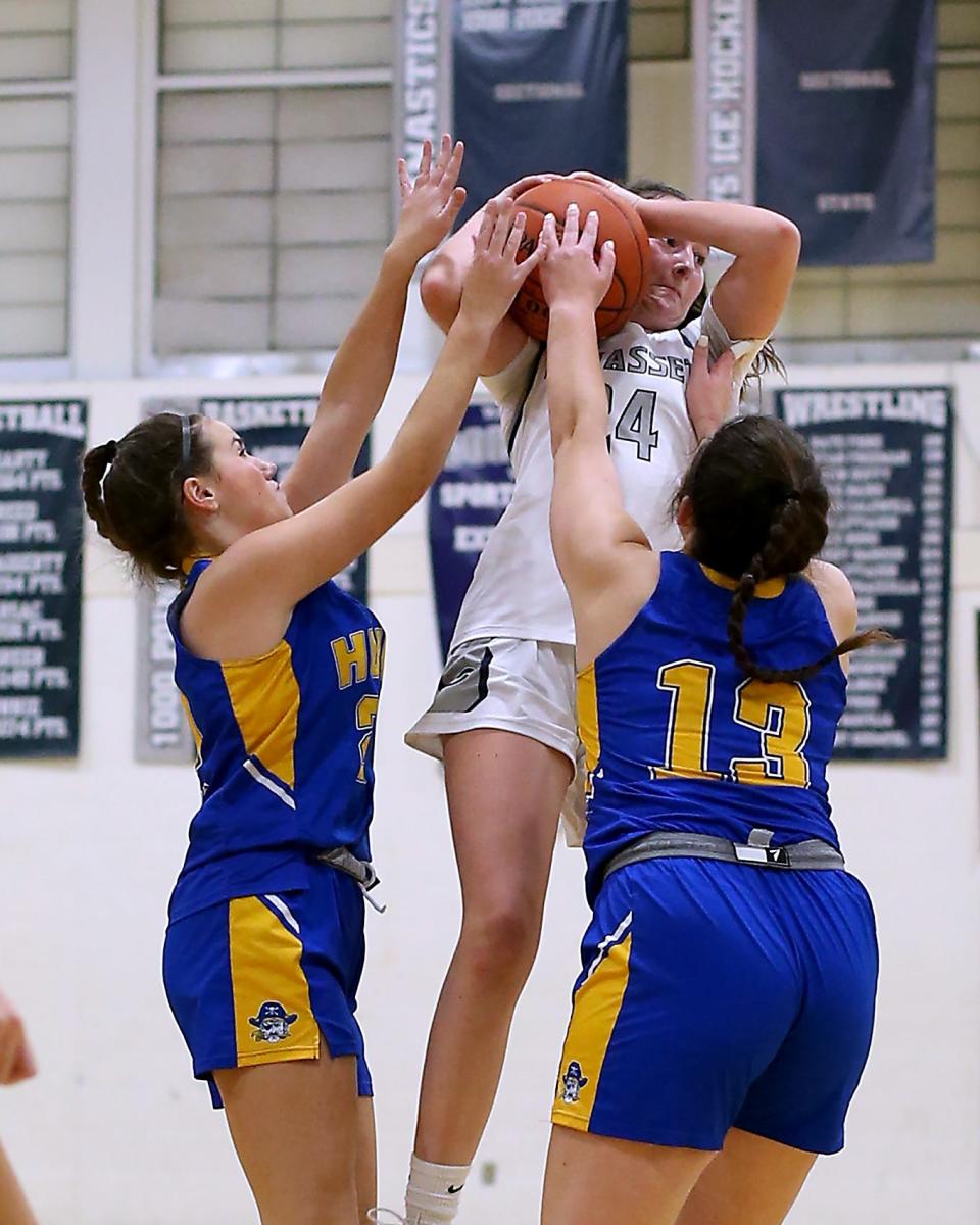 Hull’s Fallon Ryan and Hull’s Lucy Peters try to tie up Cohasset's Sarah Chenette during second-quarter action of their game against Cohasset at Cohasset High on Friday, Jan. 6, 2023.