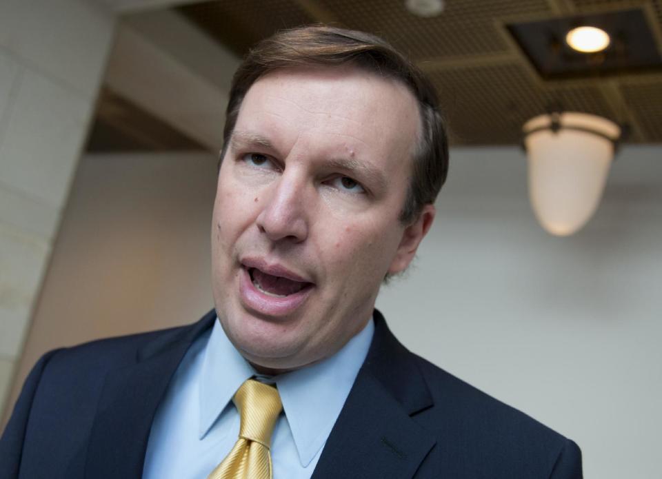 FILE - This Sept. 4, 2013 file photo shows Sen. Chris Murphy, D-Conn. speaking with reporters on Capitol Hill in Washington. Fresh voices in the U.S. Senate are speaking loudly on foreign policy, a new generation of Republicans and Democrats who reflect a war-weary nation cautious about America’s next moves. (AP Photo/J. Scott Applewhite, File)