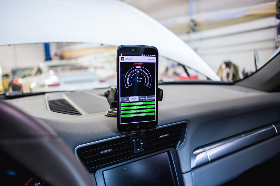 <p>Accessing the system happens through a Bluetooth-linked smartphone app, which on our test car featured selectable Street, Track, and Overboost drive modes, as well as a switch to shut the system down entirely, returning the car to near-stock form.</p>