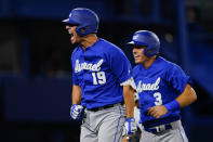 Israel's Danny Valencia, left, celebrate with Ian Kinsler after hitting a two run home run during the eight inning of a baseball game against the Dominican Republicat at the 2020 Summer Olympics, Tuesday, Aug. 3, 2021, in Yokohama, Japan. (AP Photo/Matt Slocum)