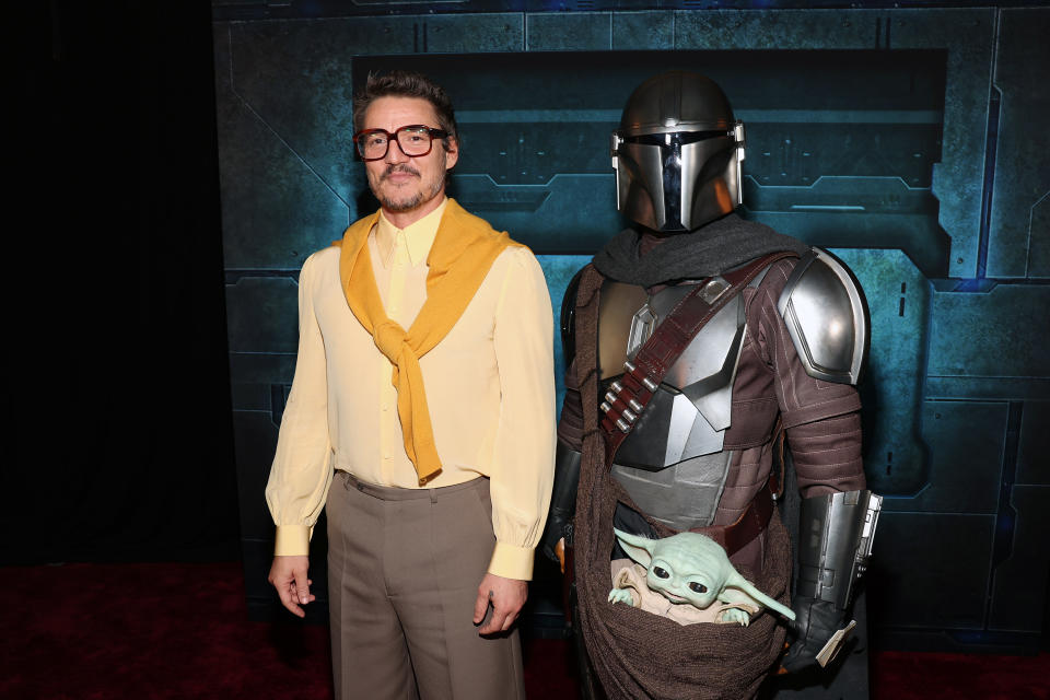 LOS ANGELES, CALIFORNIA - FEBRUARY 28: Pedro Pascal and a Disney Parks character attend the Mandalorian special launch event at El Capitan Theatre in Hollywood, California on February 28, 2023. (Photo by Jesse Grant/Getty Images for Disney)