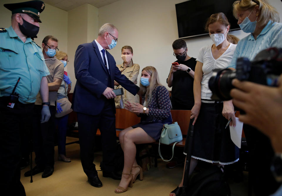 Joey Reed, father of former U.S. Marine Trevor Reed, who was detained in 2019 and accused of assaulting police officers, and Alina Tsybulnik, Trevor's girlfriend, attend a court hearing in Moscow, Russia July 30, 2020. / Credit: MAXIM SHEMETOV / REUTERS