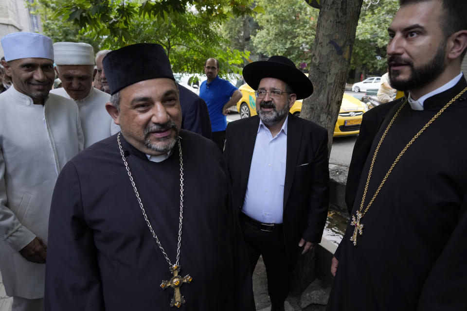 Religious leaders of the Iranian religious minorities, among them leader of the Iranian Jews Younes Hamami Lalehzar, center, arrive at a polling station to vote for the presidential election in Tehran, Iran, Friday, June 28, 2024. Iranians were voting Friday in a snap election to replace the late President Ebrahim Raisi, killed in a helicopter crash last month, as public apathy has become pervasive in the Islamic Republic after years of economic woes, mass protests and tensions in the Middle East. (AP Photo/Vahid Salemi)