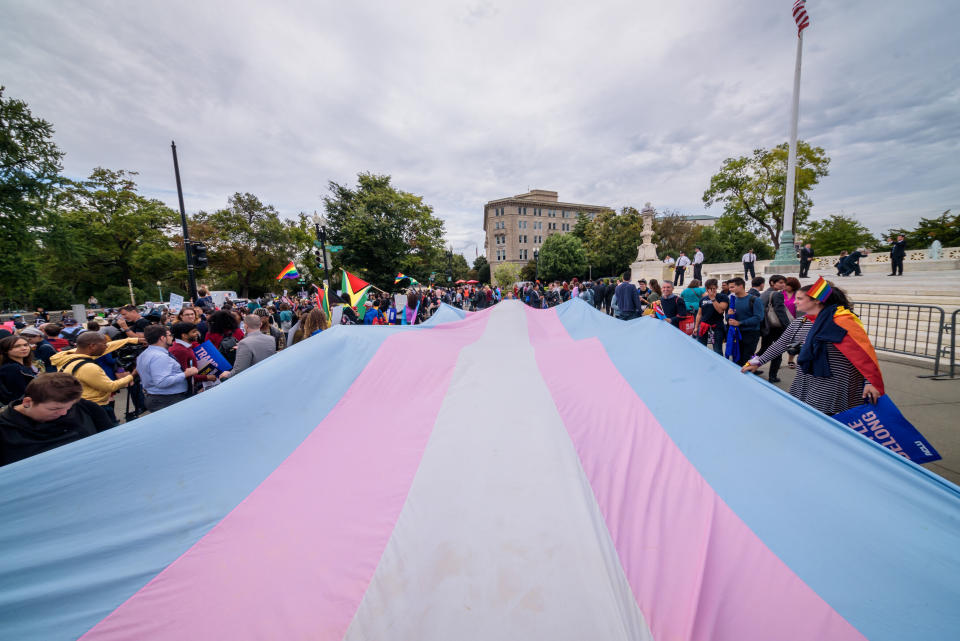 Demonstrators unfurl a giant Trans Pride flag outside the U.S. Supreme Court in 2019. (Photo: Erik McGregor via Getty Images)