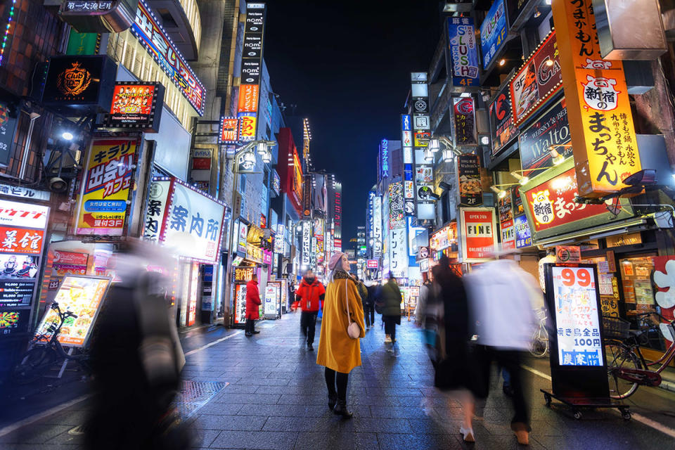 Woman in Kabuki-chō in Tokyo at night