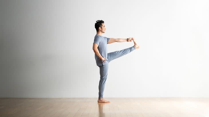 Hiro Landazuri practices Utthita Hasta Padangusthasana (Extended Hand to Big Toe Pose)