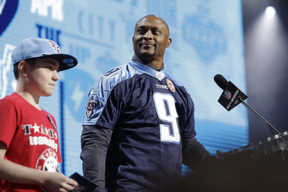 Former Tennessee Titans player Eddie George announces the pick for the Titans as Mississippi wide reciever A.J. Brown during the second round of the NFL football draft, Friday, April 26, 2019, in Nashville, Tenn. (AP Photo/Mark Humphrey)