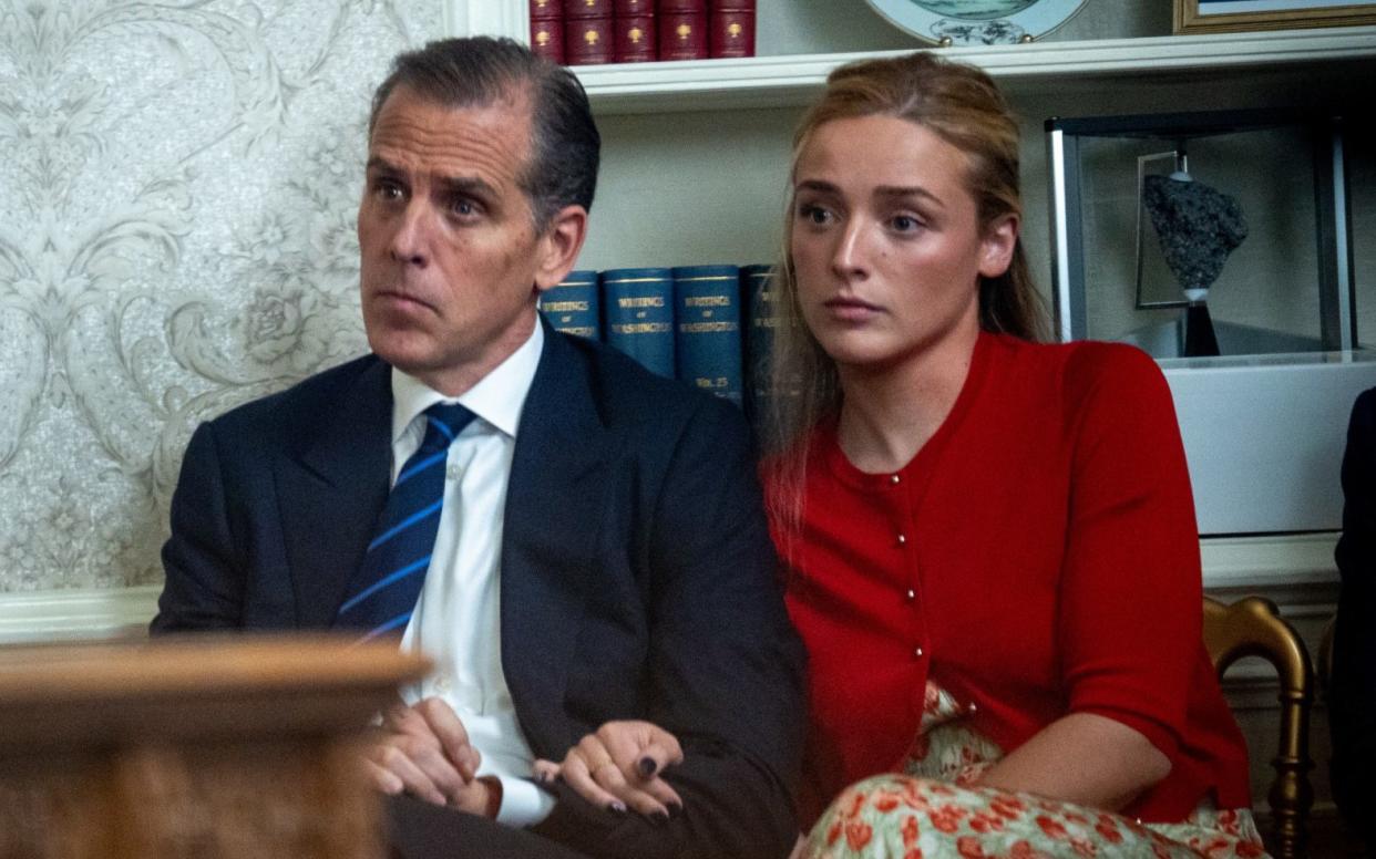 Hunter Biden and daughter Finnegan Biden watch on as President Biden gives his address