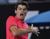 Taylor Fritz of the U.S. celebrates after defeating Kevin Anderson of South Africa in their second round singles match at the Australian Open tennis championship in Melbourne, Australia, Thursday, Jan. 23, 2020. (AP Photo/Lee Jin-man)