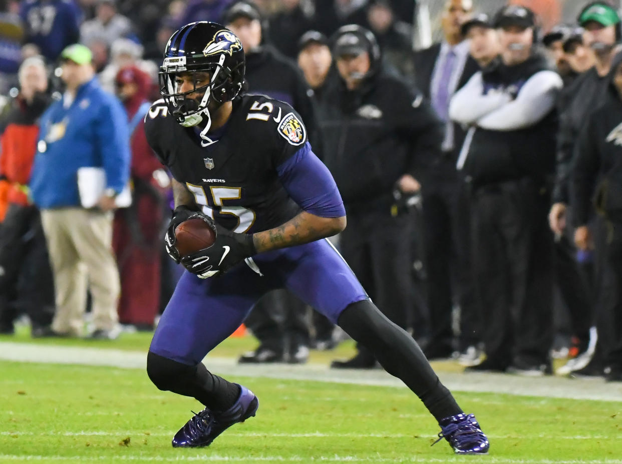 BALTIMORE, MD - DECEMBER 30, 2018: Wide receiver Michael Crabtree #15 of the Baltimore Ravens carries the ball in the second quarter of a game against the Cleveland Browns on December 30, 2018 at M&T Bank Stadium in Baltimore, Maryland. Baltimore won 26-24. (Photo by: 2018 Nick Cammett/Diamond Images/Getty Images)  