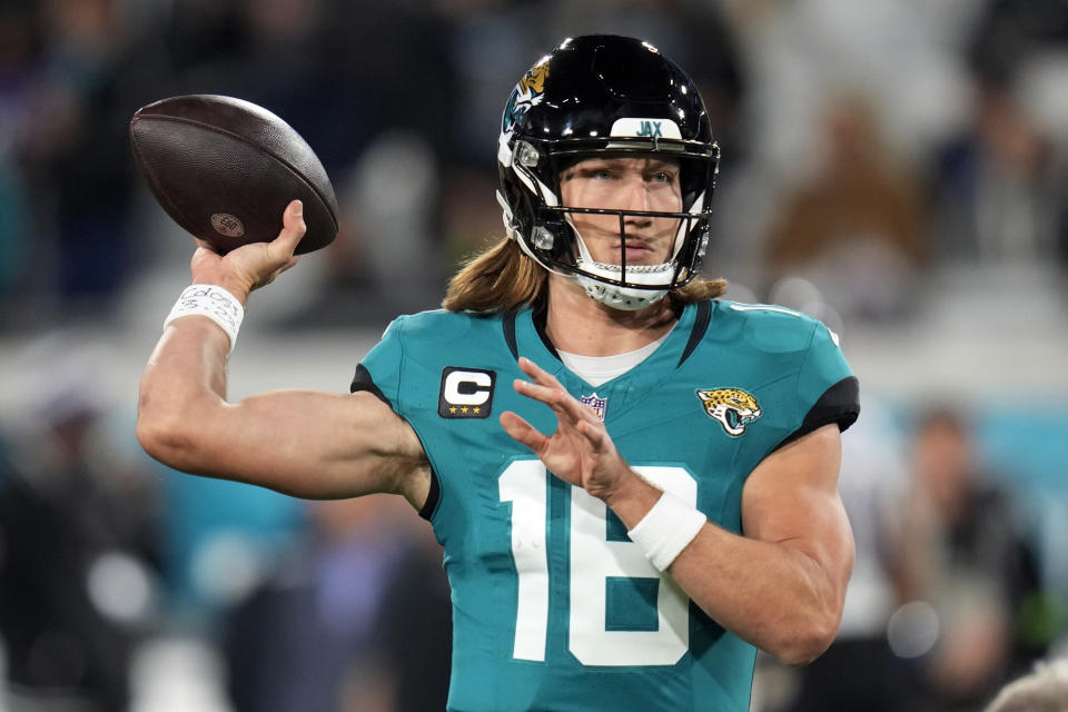 Jacksonville Jaguars quarterback Trevor Lawrence warms up before an NFL football game against the Baltimore Ravens Sunday, Dec. 17, 2023, in Jacksonville, Fla. (AP Photo/John Raoux)