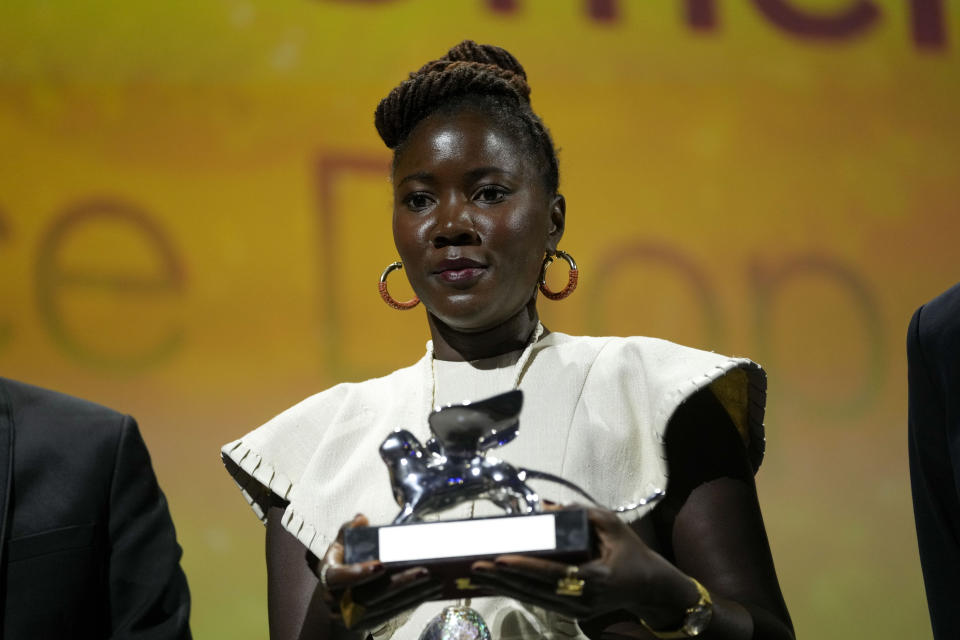 Director Alice Diop holds the Silver Lion Grand Jury Prize for the film 'Saint Omar' at the closing ceremony of the 79th edition of the Venice Film Festival in Venice, Italy, Saturday, Sept. 10, 2022. (AP Photo/Domenico Stinellis)