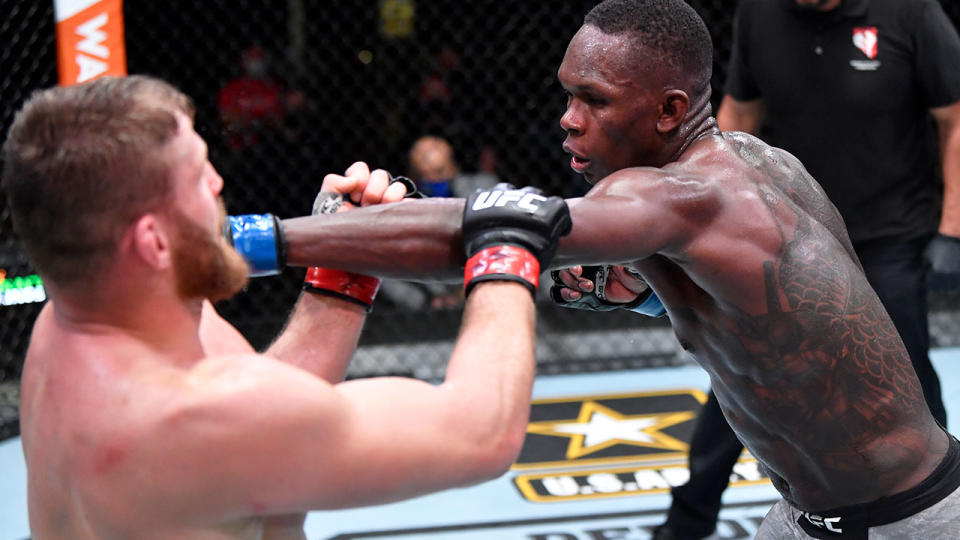 Israel Adesanya is seen here striking Jan Blachowicz at UFC 259.