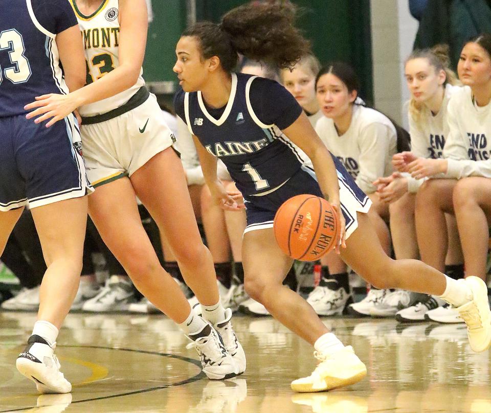 Maine's Olivia Rockwood dribbles around a screen during the Black Bears 68-60 loss to Vermont in the 2022-23 season.