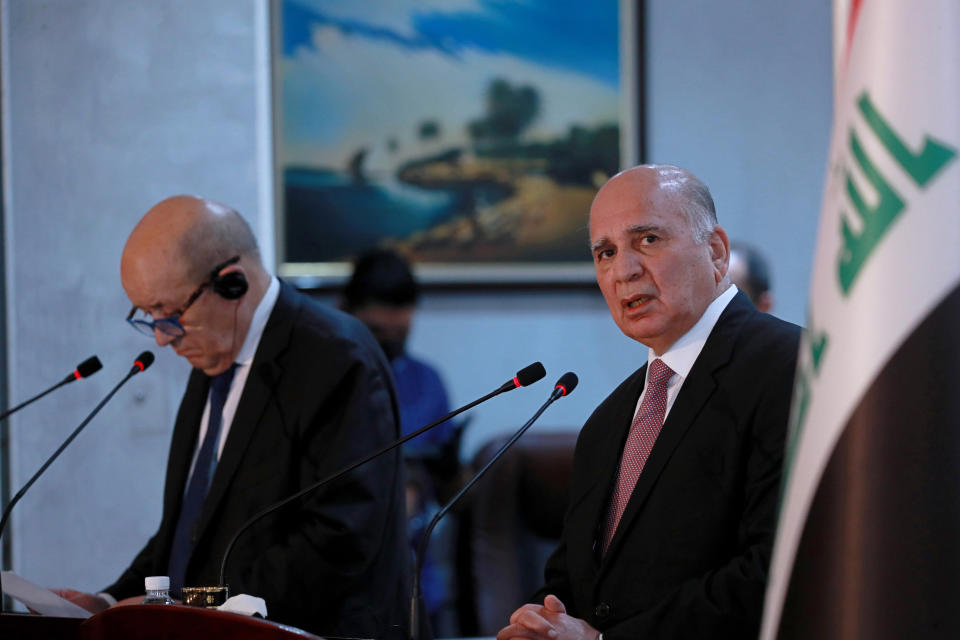 Iraqi Foreign Minister Fouad Hussein, right, and visiting French counterpart Jean-Yves Le Drian, hold a news conference following their meeting in Baghdad, Iraq, Thursday, July 16, 2020. (AP Photo/Hadi Mizban)