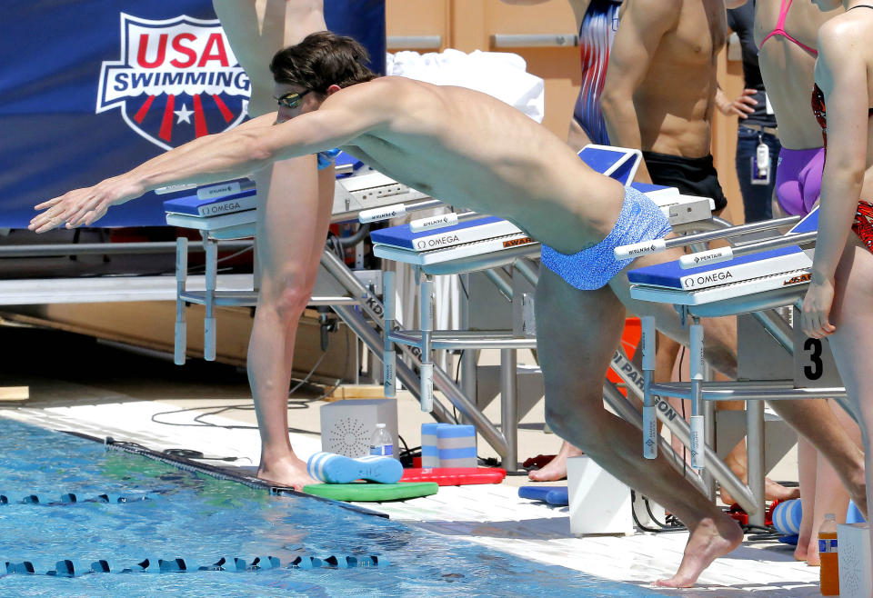 Michael Phelps practices on Wednesday, April 23, 2014, in Mesa, Ariz. Phelps is competing in the Arena Grand Prix at Mesa on Thursday after a nearly two-year retirement. (AP Photo/Matt York)