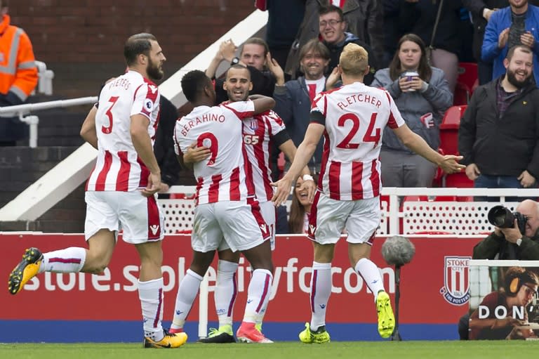 Stoke City's Jese (C) celebrates with teammates after scoring a goal during their English Premier League match against Arsenal, at the Bet365 Stadium in Stoke-on-Trent, on August 19, 2017