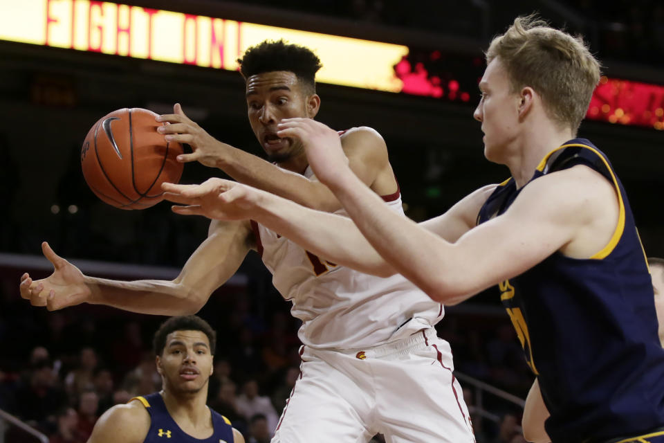 Southern California forward Isaiah Mobley, left, competes for a loose ball with California forward Lars Thiemann, right, during the second half of an NCAA college basketball game in Los Angeles, Thursday, Jan. 16, 2020. (AP Photo/Alex Gallardo)