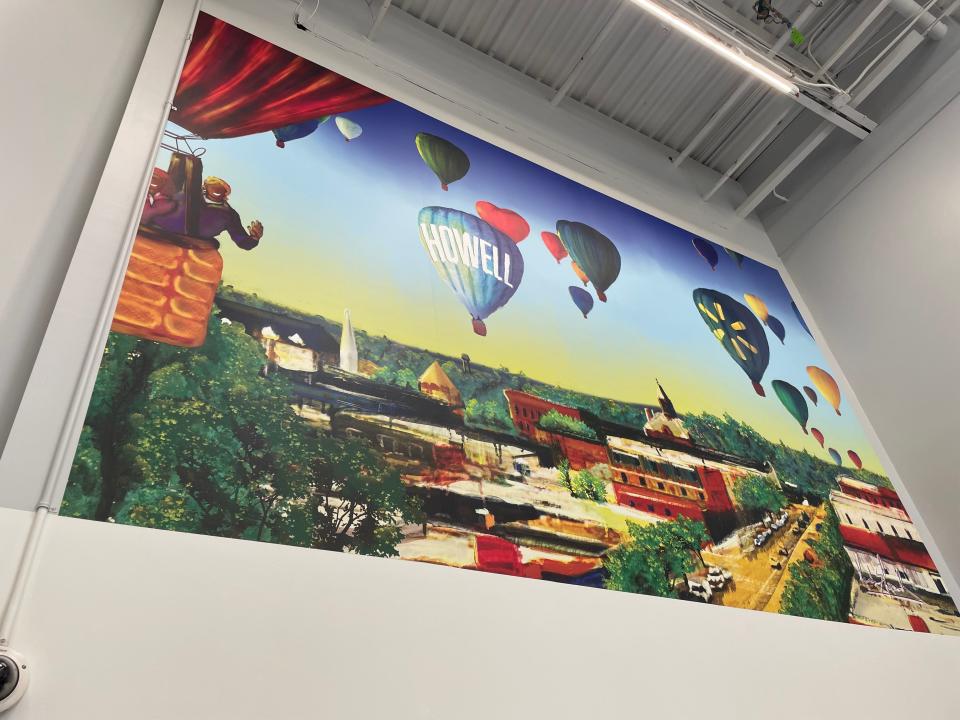 A mural inspired by Michigan Challenge Balloonfest created by artist Kurtis Edwards is installed at the entrance to Howell Walmart Supercenter.