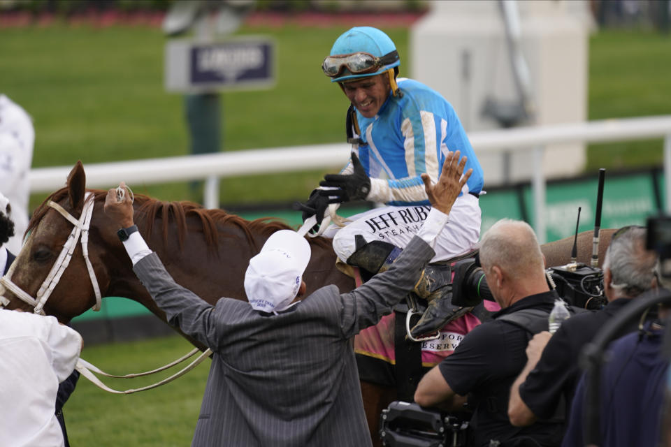 Javier Castellano celebrates after riding Mage to win the 149th running of the Kentucky Derby horse race at Churchill Downs Saturday, May 6, 2023, in Louisville, Ky. (AP Photo/Brynn Anderson)