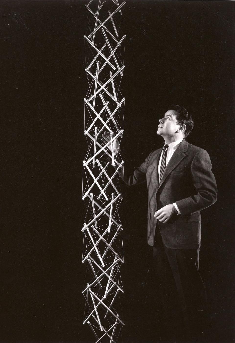 Kenneth Snelson (American, 1927-2016) stands with his "Four Way Tower," a 1963 anodized aluminum and stainless steel cable sculptured. It is one of the works that will be featured in the exhibit “Equal Forces: The Sculpture and Photography of Kenneth Snelson” from March 19 to July 7, 2024, at the University of Notre Dame's Raclin Murphy Museum of Art.