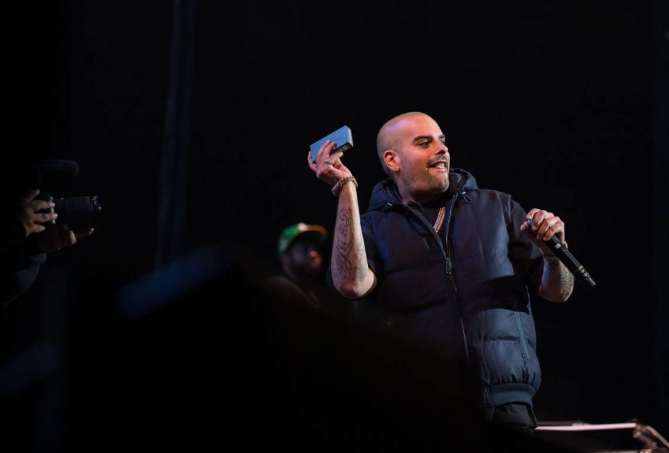 Berner, a rapper and co-founder of the cannabis brand Cookies, tosses freebies to the crowd at his performance at Snoop Dogg’s High School Reunion Tour at Sacramento’s Golden 1 Center on Friday, Aug. 25, 2023, with Wiz Khalifa, Too $hort, Warren G and DJ Drama.