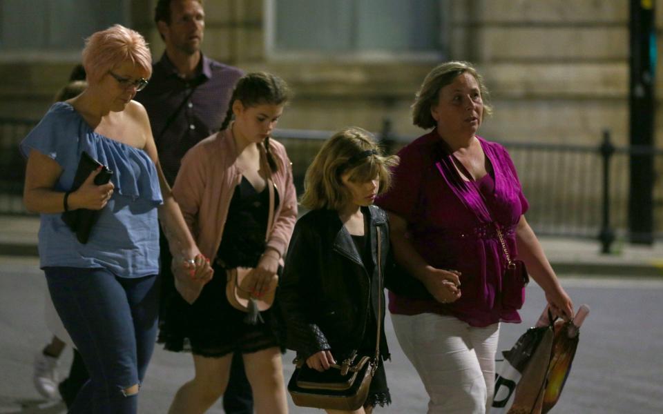 Members of the public are escorted from the Manchester Arena after the attack - Credit: Dave Thompson/Getty Images Europe