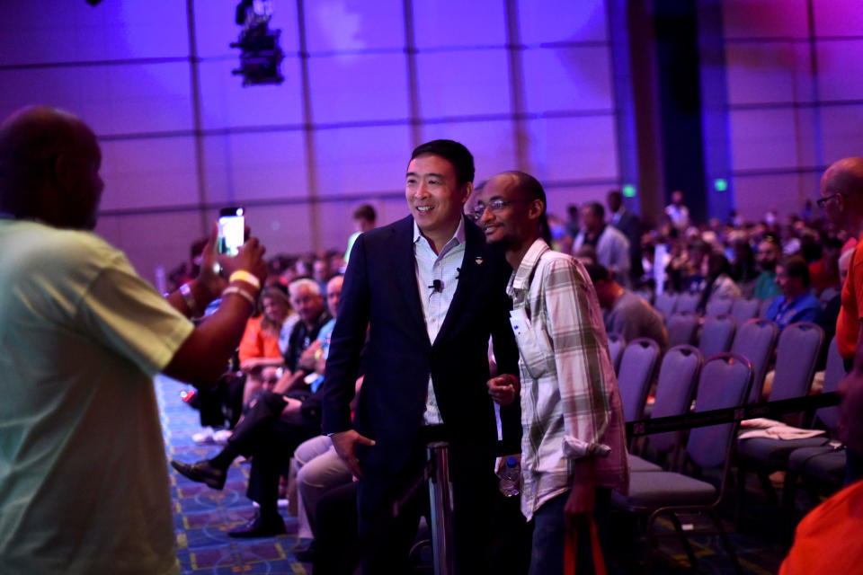 Democratic Presidential candidate Andrew Yang takes pictures with a supporter after speaking during the AFL-CIO Workers Presidential Summit in Philadelphia, U.S., September 17, 2019. REUTERS/Mark Makela