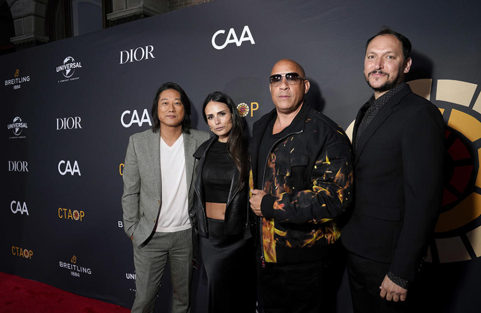 (L-R) Sung Kang, Jordana Brewster, Vin Diesel, and Louis Leterrier attend Charlize Theron's Africa Outreach Project Block Party at Universal Studios Backlot on May 20, 2023 in Universal City, California.