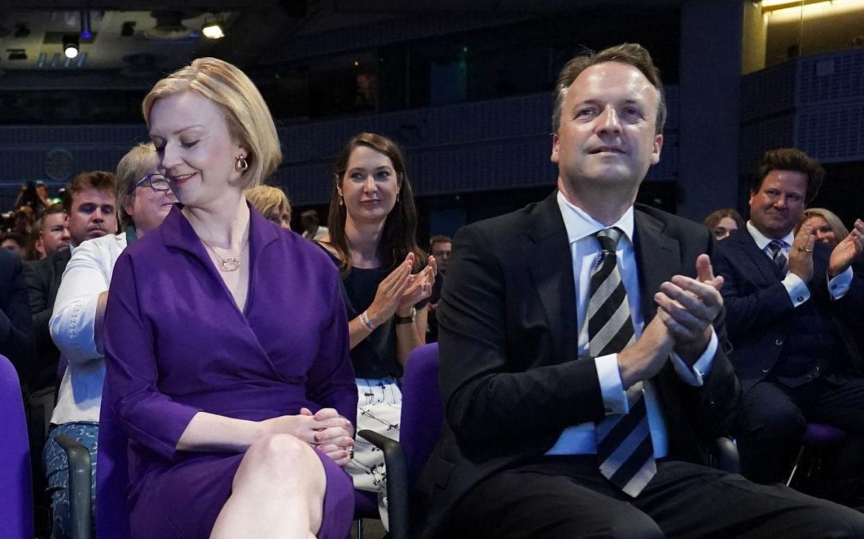 Liz Truss and her husband on the front row as results of the leadership election are read out - Stefan Rousseau/AFP