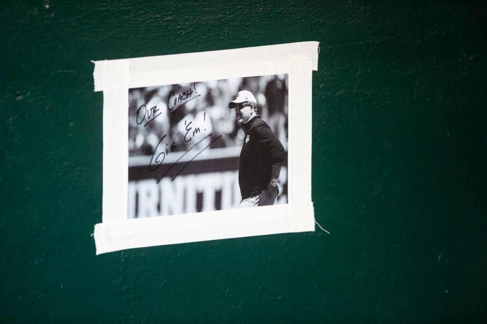 A photo of Texas A&amp;M football coach Jimbo Fisher hangs in the Aggies dugout as they take on Alabama Crimson Tide during the SEC baseball tournament at the Hoover Metropolitan Stadium in Hoover, Ala., on Friday, May 27, 2022.
