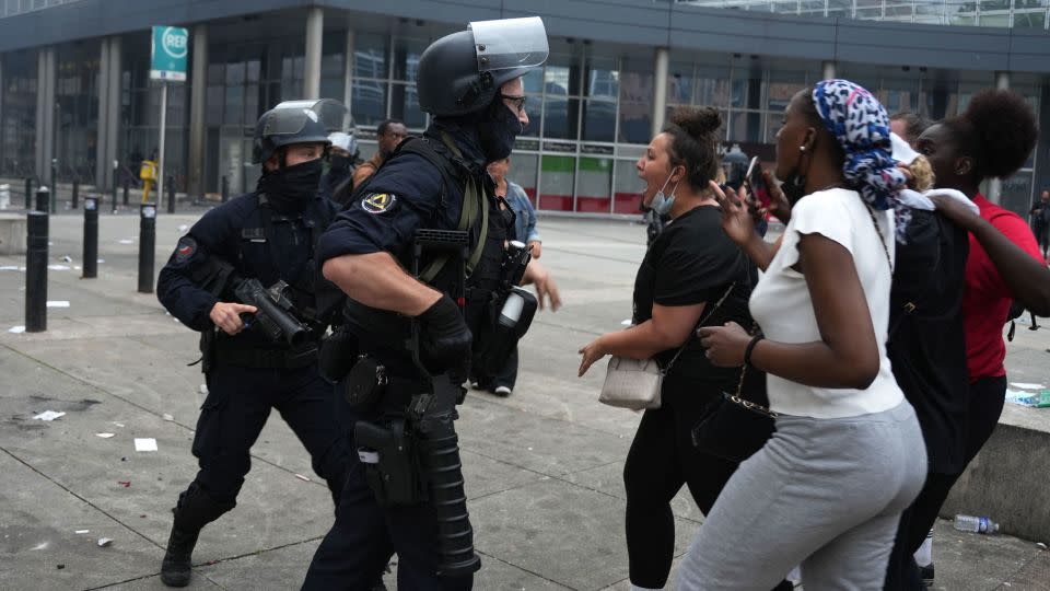 Police officers face protesters during clashes that broke out in the Parisian suburb of Nanterre on June 29. - Zakaria Abdelkafi/AFP/Getty Images