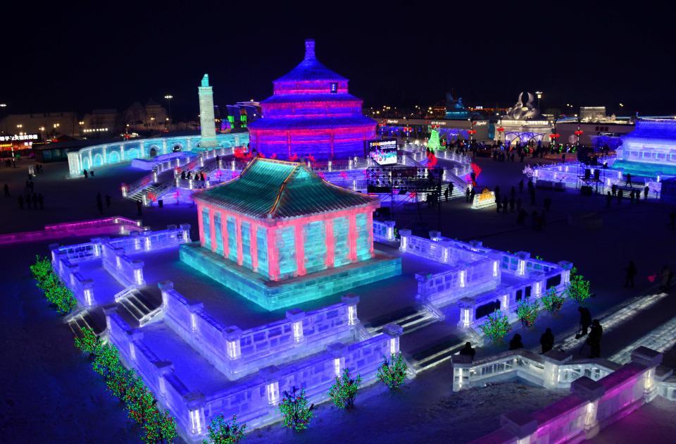 <p>Tourists enjoy spectacular ice and snow sculptures at the Harbin Ice and Snow World park in Harbin, China, on Jan. 2. (Photo: Sipa Asia/REX/Shutterstock) </p>