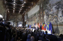 European Council President Donald Tusk, panel right, speaks to EU leaders during an EU summit meeting at the Orazi and Curiazi Hall in the Palazzo dei Conservatori in Rome on Saturday, March 25, 2017. European Union leaders were gathering in Rome to mark the 60th anniversary of their founding treaty and chart a way ahead following the decision of Britain to leave the 28-nation bloc. (AP Photo/Alessandra Tarantino)