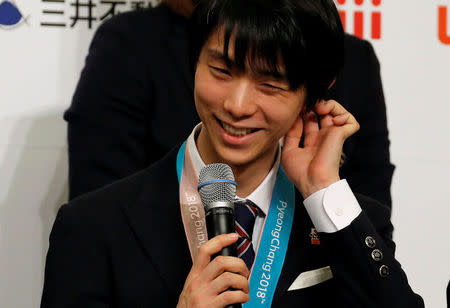 Pyeongchang 2018 Winter Olympics Men's figure skating gold medallist Yuzuru Hanyu attends a news conference with other medalists upon their return from the Pyeongchang Winter Games, in Tokyo Japan, February 26, 2018. REUTERS/Toru Hanai
