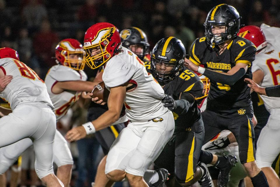 Watkins Memorial senior Isaac Solomon tries to bring down Big Walnut junior Nate Severs in their Division II, Region 7 quarterfinal at Ascena Field on Friday, Nov. 4, 2022. The Warriors fell to the Golden Eagles 35-21 to finish 9-3 in their best season since 2006.