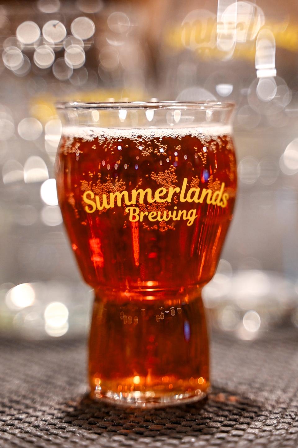 A tasting glass with the Summerlands Brewing logo on Tuesday, Jan. 16, 2024, in Holt.