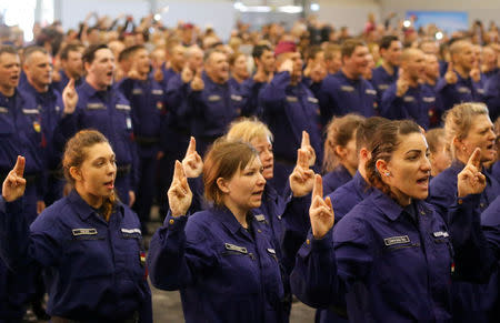 Hungarian border hunter recruits take oath during a swearing in ceremony in Budapest, Hungary, March 7, 2017. REUTERS/Laszlo Balogh