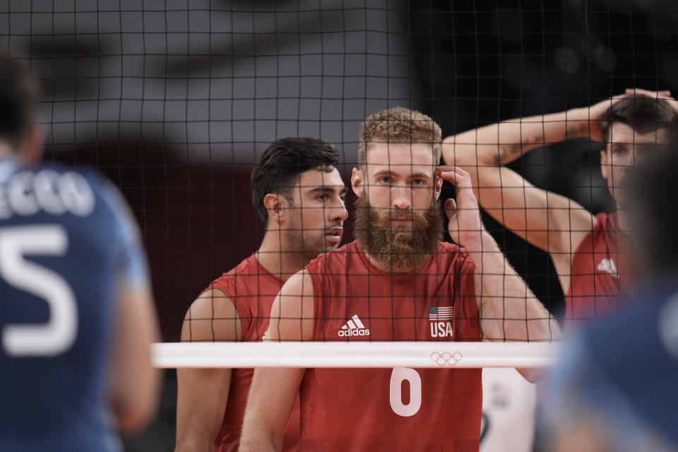 Mitchel Stahl, of the United States, takes his position at the net during a men's volleyball preliminary round pool B match against Argentina, at the 2020 Summer Olympics, early Monday, Aug. 2, 2021, in Tokyo, Japan. (AP Photo/Manu Fernandez)