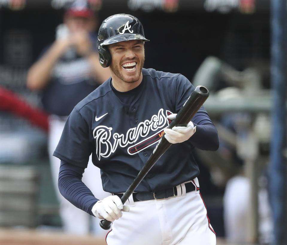 Atlanta Braves first baseman Freddie Freeman reacts during an intrasquad baseball game Saturday, July 18, 2020, in Atlanta. It was Freeman's first game since his battle with COVID-19. (Curtis Compton/Atlanta Journal-Constitution via AP)