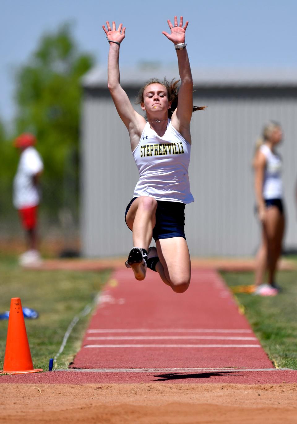 Stephenville’s Victoria Cameron flies through the air during the girls long jump Friday at the District 5 & 6-4A area meet.