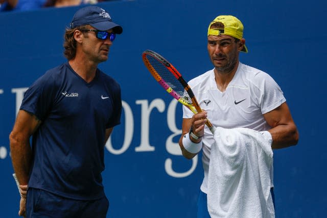 Rafael Nadal talks to coach Carlos Moya during a practice session at Flushing Meadows