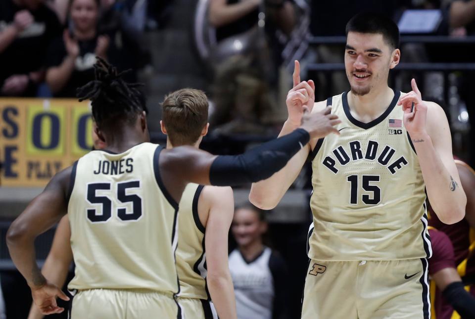 Purdue Boilermakers guard Lance Jones (55) and Purdue Boilermakers center Zach Edey (15) celebrate during the NCAA men’s basketball game against the Minnesota Golden Gophers, Thursday, Feb. 15, 2024, at Mackey Arena in West Lafayette, Ind.