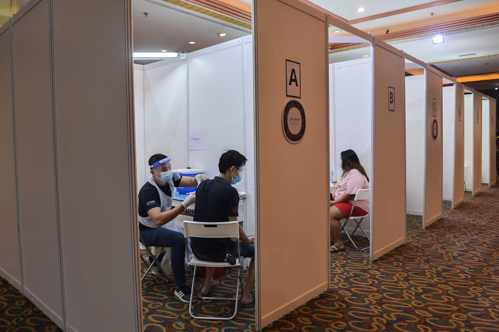 People taking the Covid-19 jab during the launch of the Prihatin vaccination service at Grand Seasons Hotel July 15, 2021. — Picture by Miera Zulyana