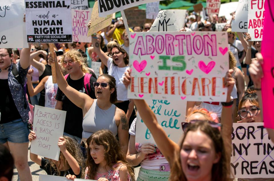 Hundreds of people attend an abortions rights rally in response to the U.S. Supreme Court decision overturning Roe v. Wade on Saturday, June 25, 2022 in downtown Athens.