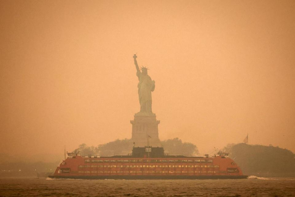 PHOTO: The Statue of Liberty is covered in haze and smoke caused by Canadian wildfires, in New York, June 6, 2023.    (Amr Alfiky/Reuters)