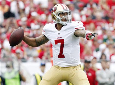 Dec 15, 2013; Tampa, FL, USA; San Francisco 49ers quarterback Colin Kaepernick (7) throws the ball against the Tampa Bay Buccaneers during the first half at Raymond James Stadium. Kim Klement-USA TODAY Sports