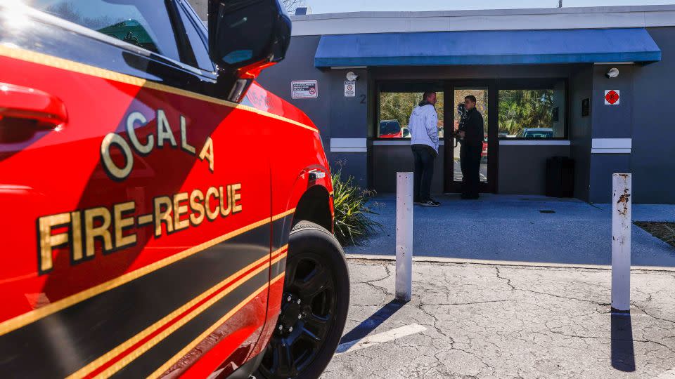 Ocala Fire Rescue Capt. Jesse Blaire, right, speaks with a man seeking treatment at Beacon Point, an integrated care center for treating people with substance use disorders in Ocala, Florida. - Ivy Ceballo/Tampa Bay Times/KFF Health News