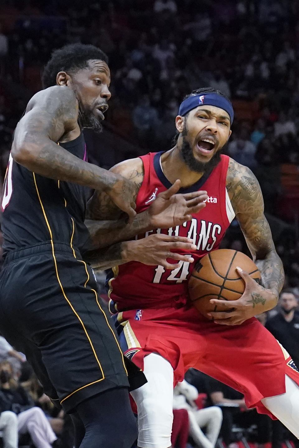 New Orleans Pelicans forward Brandon Ingram (14) drives against Miami Heat forward Udonis Haslem during the second half of an NBA basketball game, Wednesday, Nov. 17, 2021, in Miami. (AP Photo/Wilfredo Lee)